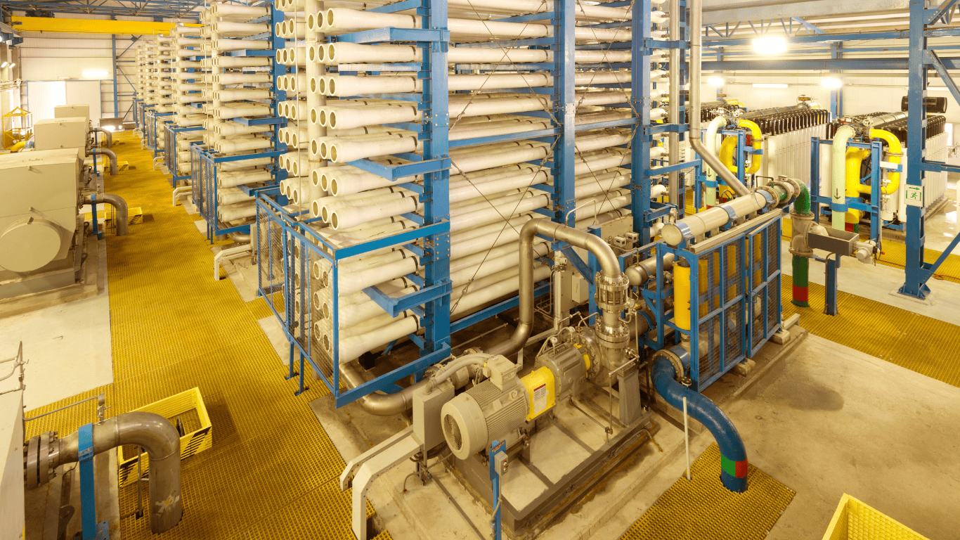 Seawater Desalination and Water Treatment Systems featuring industrial seawater reverse osmosis (SWRO) membrane racks and high-pressure pumps inside a modern desalination facility, illustrating ProChem Water systems for seawater desalination, membrane desalination, desalination pretreatment, brine management, industrial and municipal desalination, and high-purity water production.