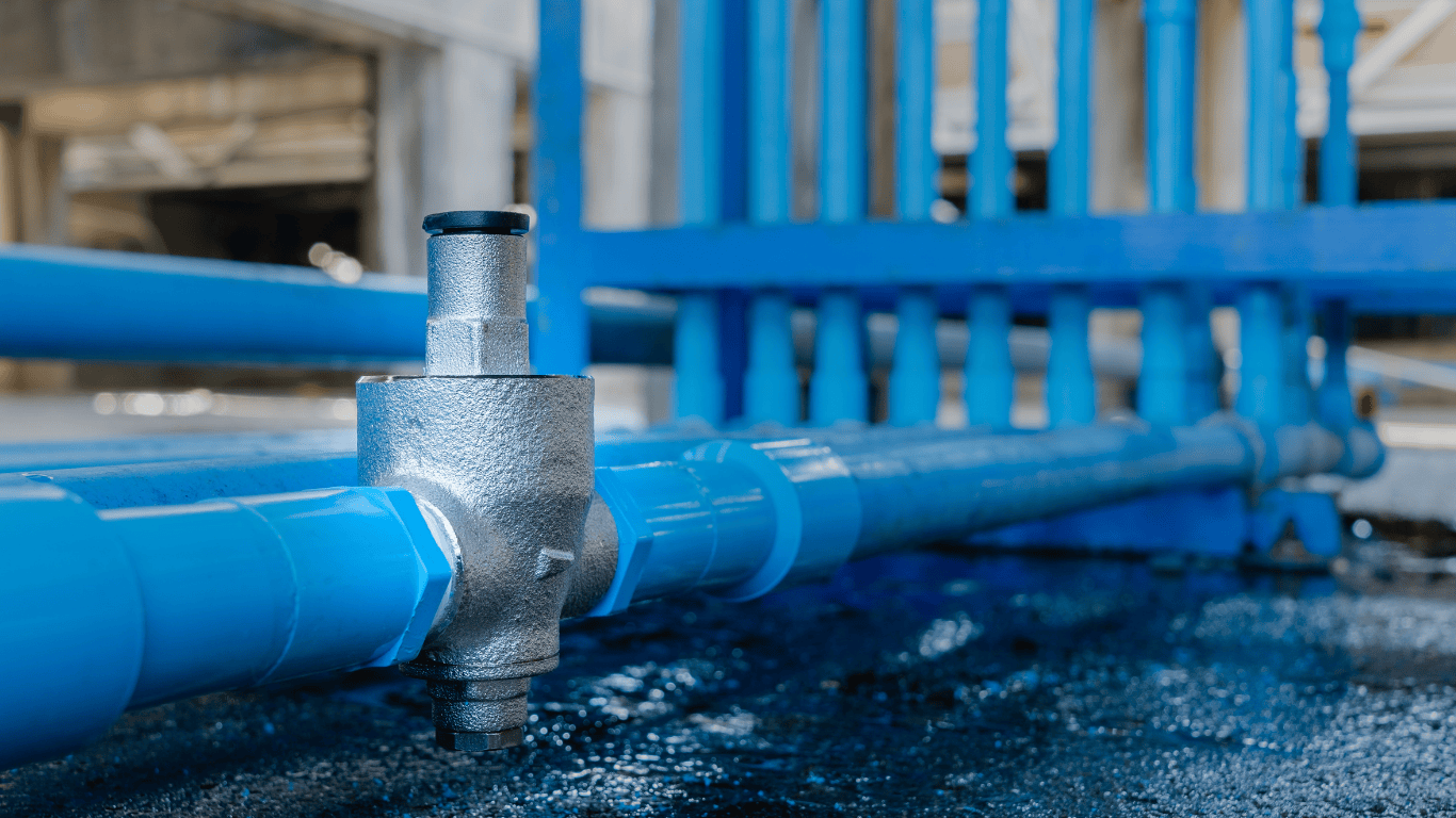 Industrial pressure-reducing valve on blue water pipes, essential for how to reduce water use by controlling water pressure and minimizing water waste in plumbing fixtures like kitchen faucets, toilets, and irrigation systems. This valve helps save water by reducing water loss in commercial car wash systems and laundry rooms, conserving water resources and lowering water consumption. By preventing leaks and running toilets, it supports energy savings, reduces carbon footprint, and helps cut water bills. Water conservation methods including using water butts, filling buckets instead of running hoses, only running full loads of dishwashers and washing machines, and covering pools to reduce evaporation all complement such devices. Effective water management protects the surrounding environment, reduces runoff, and maintains moisture for plants while ensuring compliance with local regulations and sustainable water treatment practices.